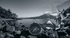 苫小牧・支笏湖の境界で発生する磁気異常と、脳の感覚バグにより歪んで見える「異界」の風景を象徴する、消炭色の概念的なコンパスと幾何学的歪みの画像。